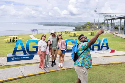 Visitors taking photos at the Agua Clara Panama Canal visitor area