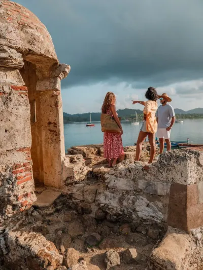 Visitors at a Spanish colonial fort overlooking Portobelo Bay