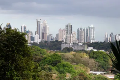 Panama City skyscrapers rising above the Metropolitan Natural Park forest canopy