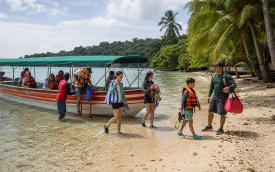 Travelers arriving by boat at an Isla Grande beach