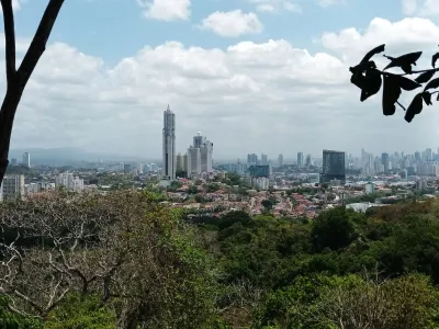 Sunlit Panama City skyline seen from a Metropolitan Natural Park lookout